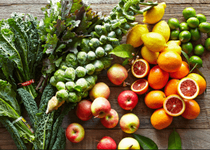 a group of fruits and vegetables on a wood surface Healthy Weight Loss Diets Leatherhead